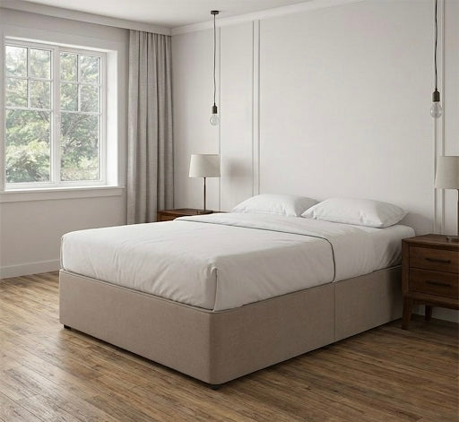 Plain bedroom with a neutral upholstered bed